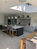 Contemporary Grey Kitchen Island with Skylight Dining Space