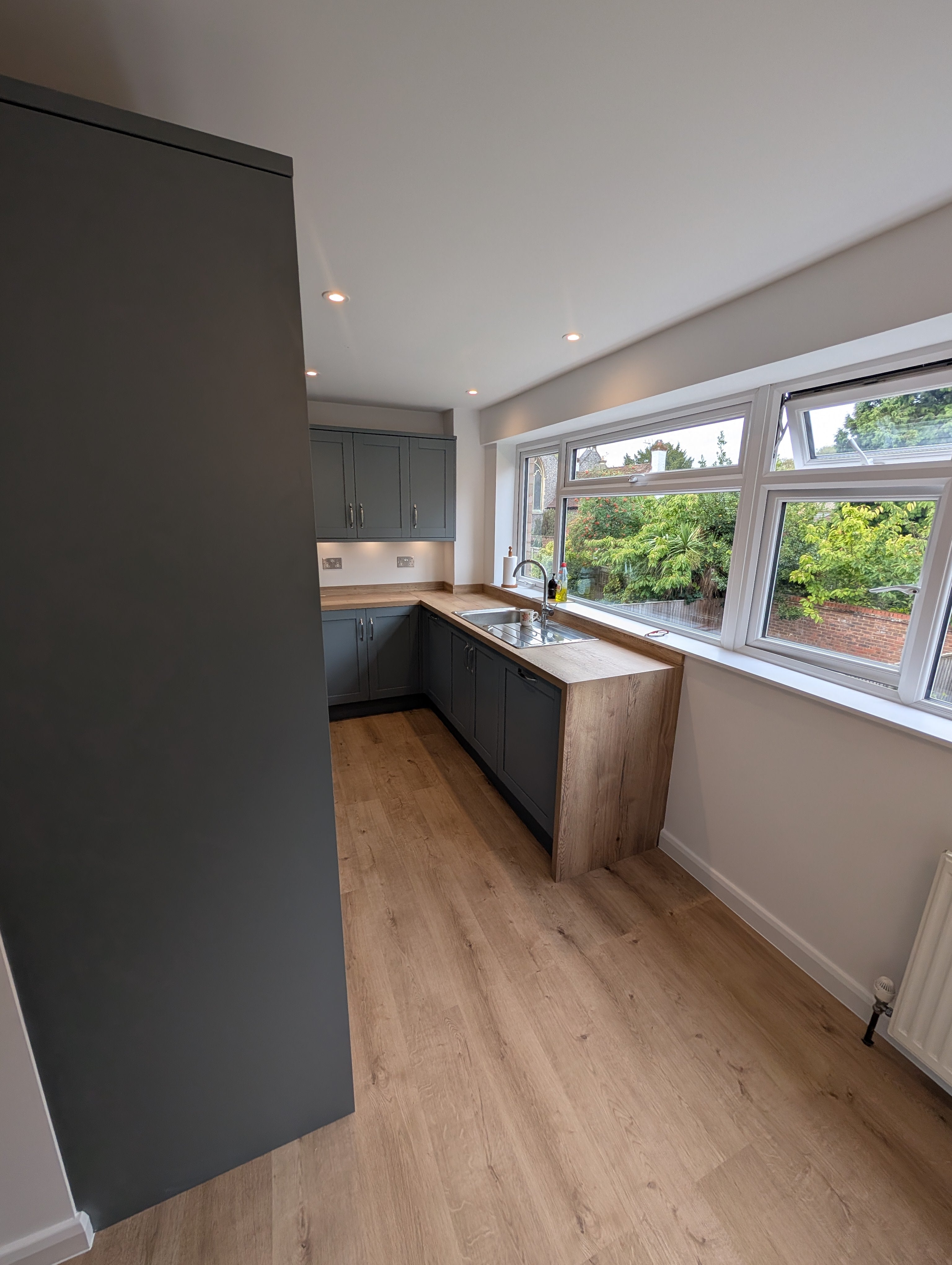 Bright Grey Kitchen with Panoramic Garden Views